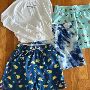 Lot of boys swim trunks and 1 rash guard